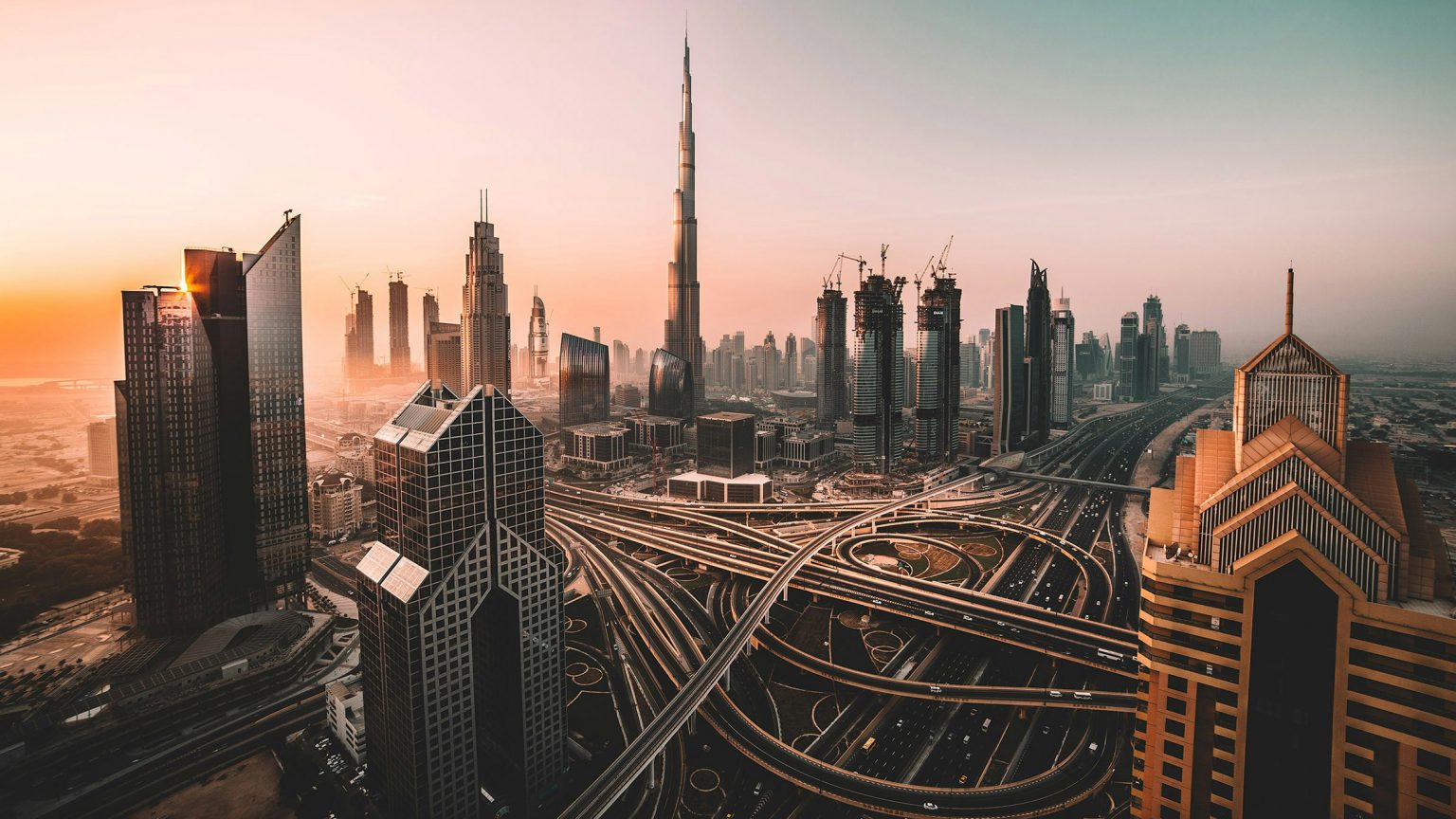 Burj Khalifa and the Dubai skyline at sunset